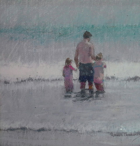 Testing the water - a family paddling in the sea